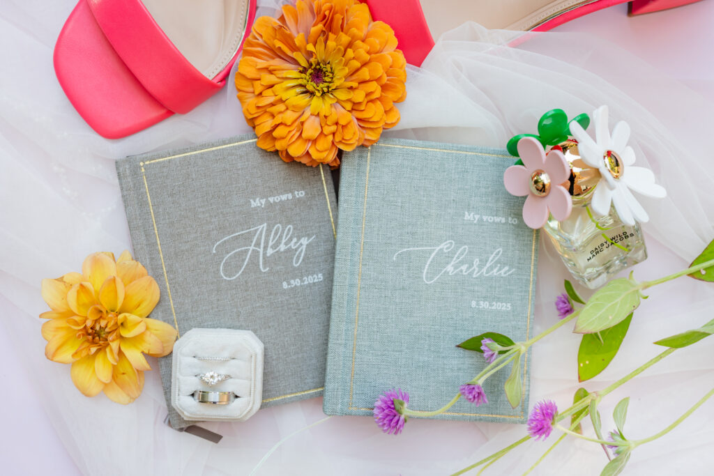 Editorial wedding details photographed in Pittsburgh, featuring invitation suite, florals, and wedding rings.